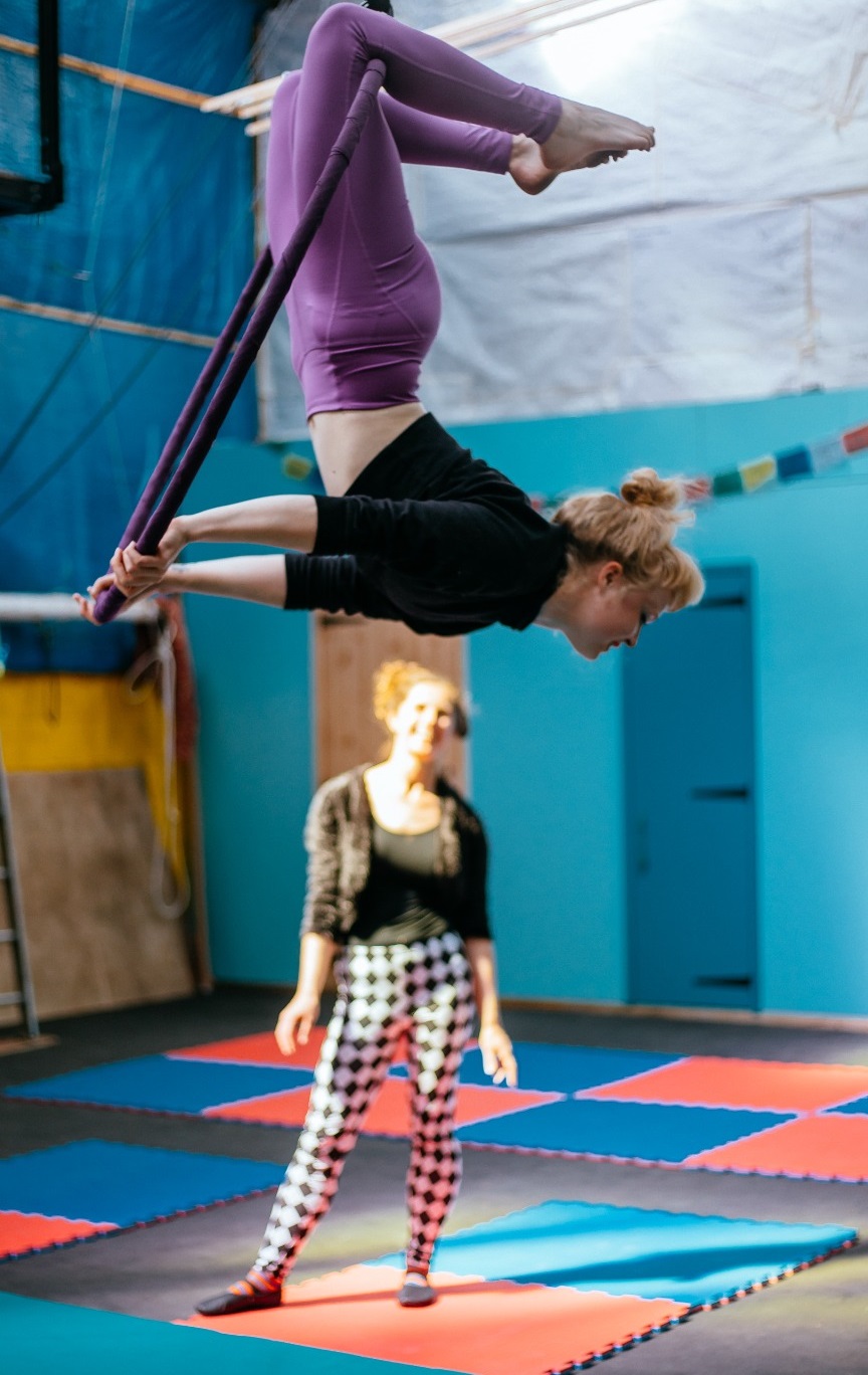 Somebody enjoying their first aerial hoop workshop