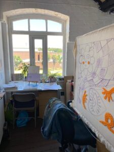 Artists like Molly and Denisa create their work in a studio space at Open Source Arts.