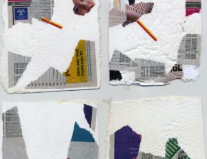 A selection of handmade paper laid out in four stacks