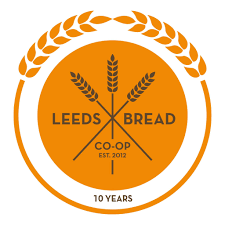 leeds bread coop co-lab kitchen open source arts leeds logo on a bright orange background